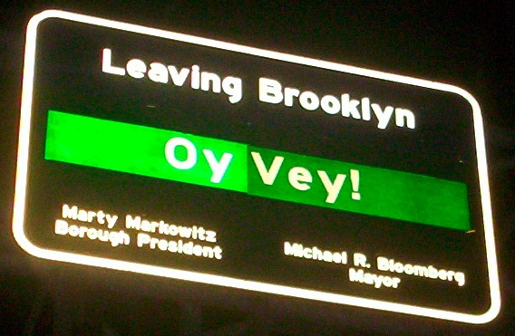 Sign leaving Brooklyn on Williamsburg Bridge -- Oy vey! Leaving Brooklyn! Creative Commons Attribution ShareAlike 2.0. Picture by gill from Glasgow, uk (http://www.flickr.com/people/21324809@N00)
