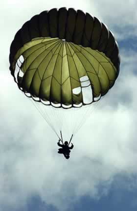 A Republic of the Philippines Marine Corps (PMC) Marine descends beneath his MC1-C parachute after jumping from a US Marine Corps (USMC) KC-130 Hercules. VIRIN: 060226-F-2114K-049